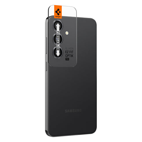 AGL07425 - Galaxy S24 Ultra Optik Pro EZ Fit Lens Protector in Black showing the camera lens protector hovering above another lens protector tray and device showing back
